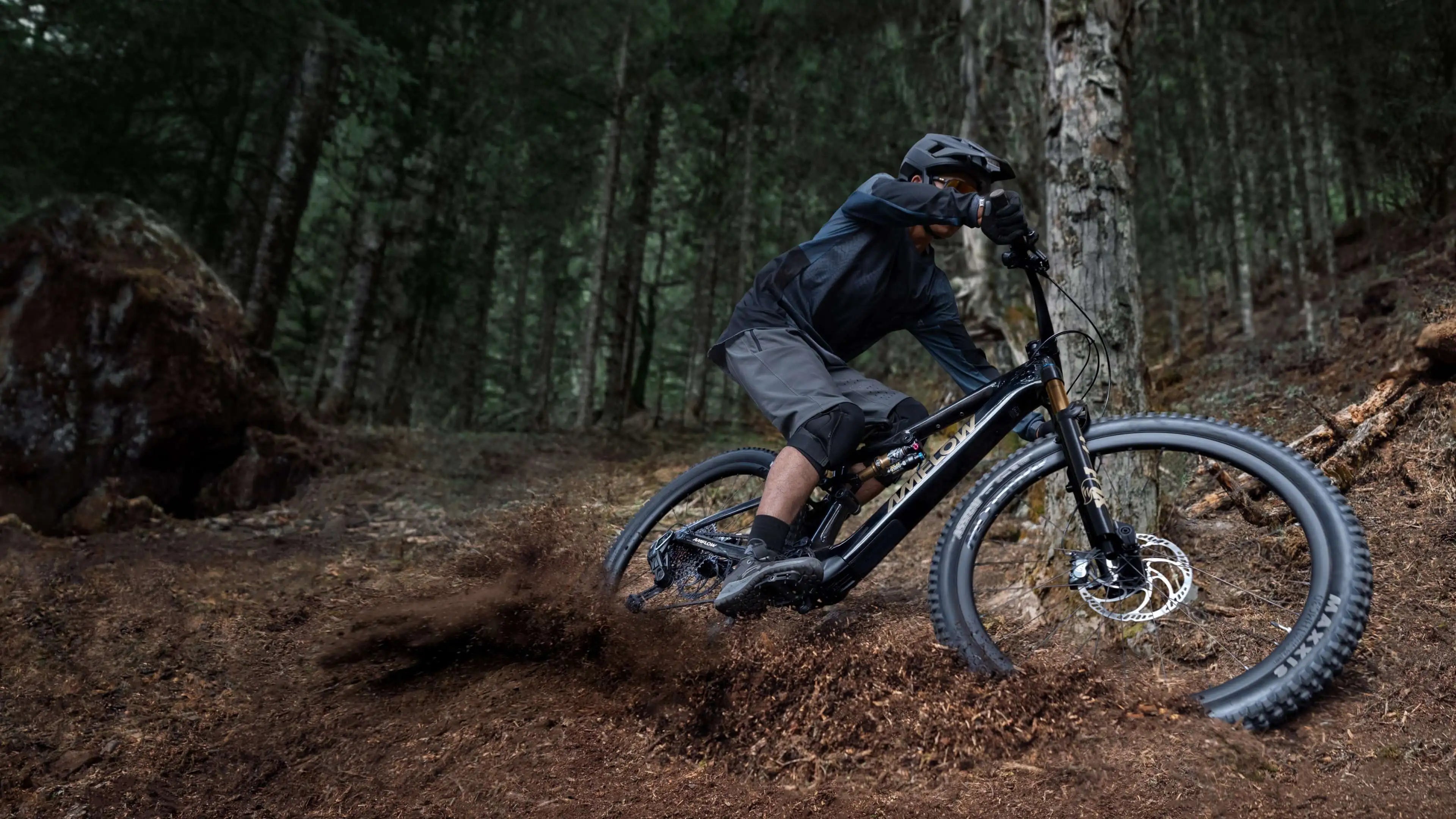 mountain biker on path with amflow bike